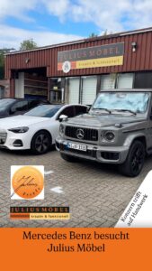 Vor der Werkstatt von Julius Möbel standen ein grauer Mercedes-Benz G-Wagen und ein weißer Audi.